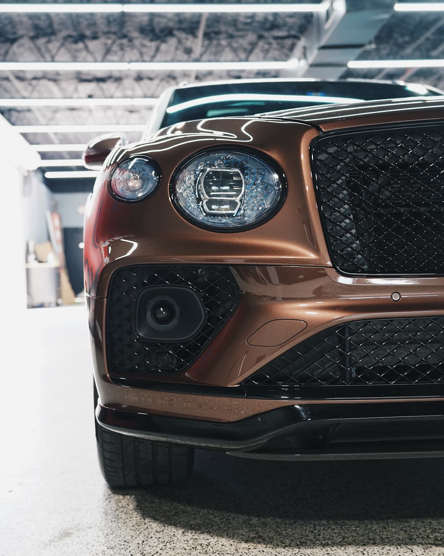 Bronze Bentley Bentayga front end in the bay